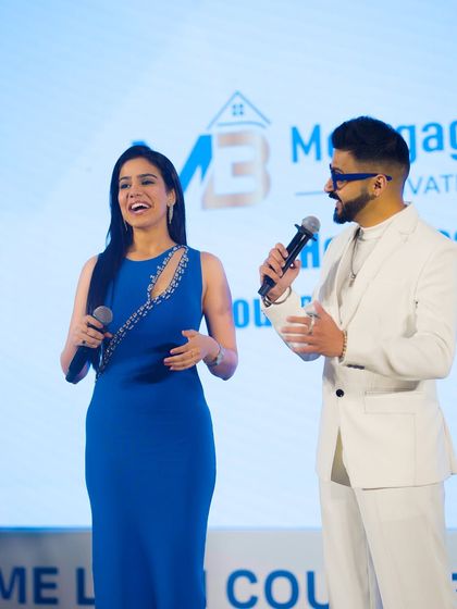 Sharing a laugh with my co-host on stage. Even in a corporate setting, a little humour goes a long way in keeping the energy up.