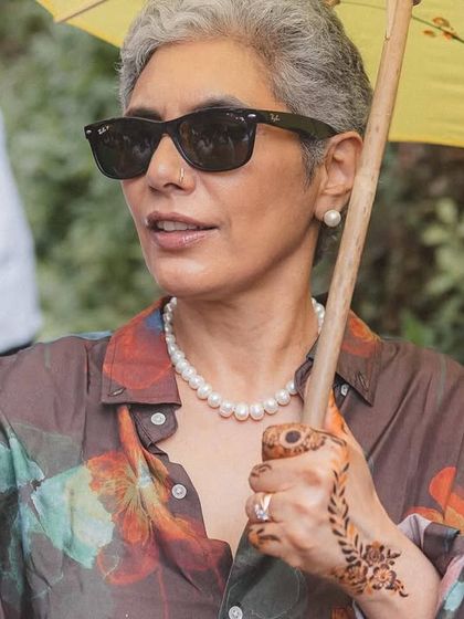 A guest captures a selfie during the Baraat procession at a beautiful destination wedding. We ensure that every guest has a wonderful and memorable experience.