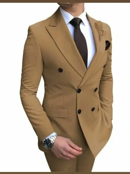 This tan double breasted suit is a sophisticated choice for daytime events or summer weddings. The peak lapels and clean lines are hallmarks of my bespoke tailoring service.