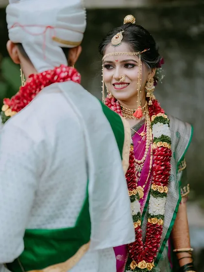 The bride's loving gaze at her groom during the wedding ceremony. This over-the-shoulder shot creates a personal and intimate perspective.