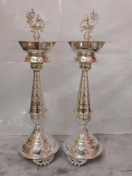 A pair of tall, 20-inch German silver Nakashi deepams, perfect for placing at the entrance of a home or temple for a grand statement.
