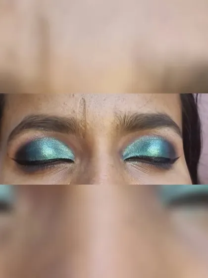 A detailed shot of a green and black half smokey eye, showing the blending of colors.