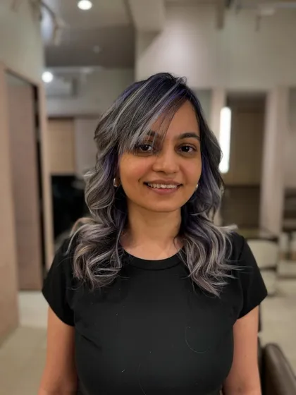 A happy client showing off her 'Winter Frost' hair. The mix of ash and purple is unique and totally wearable.