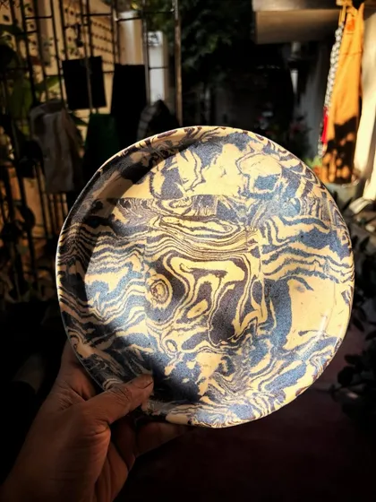 This student completed both her beginner and advanced courses with us. For her advanced work, she found her rhythm with the Nerikomi technique, creating this beautiful and calm set of patterned plates and bowls.