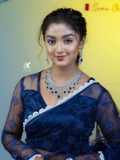 Dolled up the lead of 'Lakshmi Baaramma', Bhoomika Ramesh, for the Anubhanda Awards. This glamorous look features a smokey eye and a radiant base, ensuring she looked stunning on the red carpet.