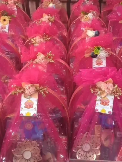 A sea of pink! These hampers, wrapped in vibrant fuchsia netting, show how I can use color to match your event's theme perfectly. This style is great for bachelorette parties or a sangeet.