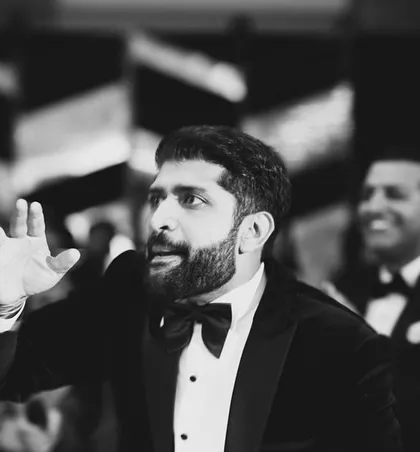 A black and white shot of a groom's performance, capturing the intensity and emotion of the moment.