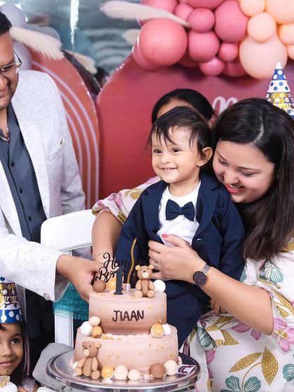 A vibrant 'Super Mario' themed birthday party, with character cutouts, a custom backdrop of the Mushroom Kingdom, and red and green balloons, ready for an adventure.