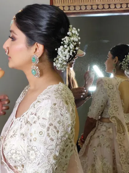 A side view of the baby's breath bun, showing how it beautifully frames the client's face.
