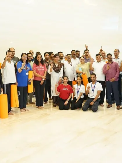 A happy group of ONGC employees after a rejuvenating wellness program. The smiles on their faces are a testament to the immediate positive impact of taking a conscious break for self-care.