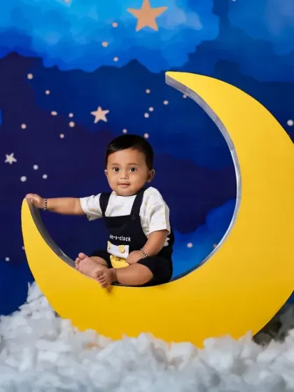 Another sweet baby enjoying the moon and stars theme. It's a versatile setup for creating magical memories.
