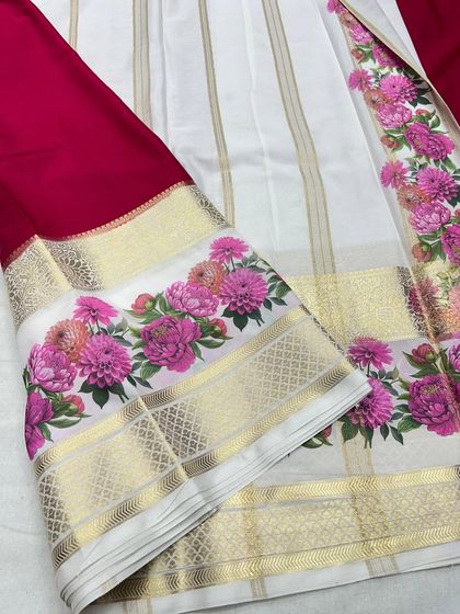 The beautiful drape of the white and maroon semi-Mysore crepe saree.