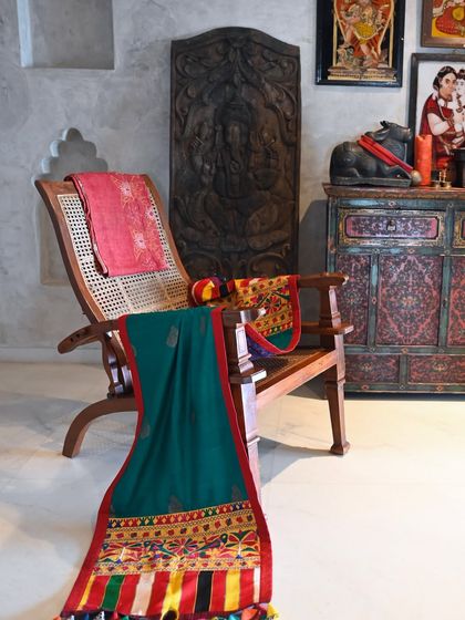 A custom-made, upcycled textile throw created for a client who wanted something rich and rooted in tradition. We paired a vibrant green Banarasi silk body with a colorful vintage Rabari embroidery panel.