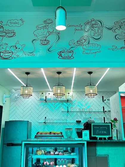 This doodle wall at Café Quaint tells the story of its journey, from its beginnings to becoming a beloved community spot. We mapped out key moments in the café's history, and I brought them to life with flowing lines and illustrations, creating a unique piece of storytelling wall art.