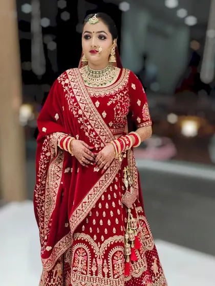 Another angle of this stunning bride in her red lehenga. The focus was on creating a timeless look with a flawless base and elegant eye makeup.