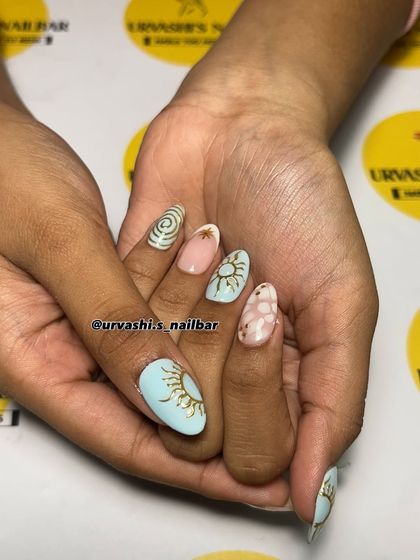 A celestial-inspired set with a dreamy pastel palette. I hand-painted sun motifs, stars, and swirls, combining different designs for a whimsical and artistic manicure.