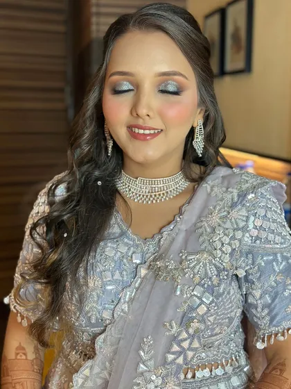Sangeet night glam with striking silver glitter eyeshadow and a flawless base.