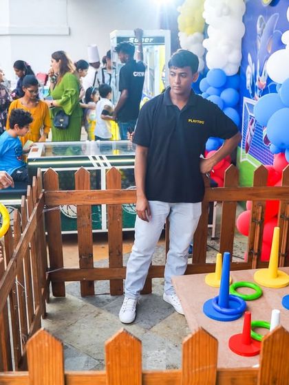 A classic ring toss game stall, themed for the Sonic party, provides fun for guests of all ages.