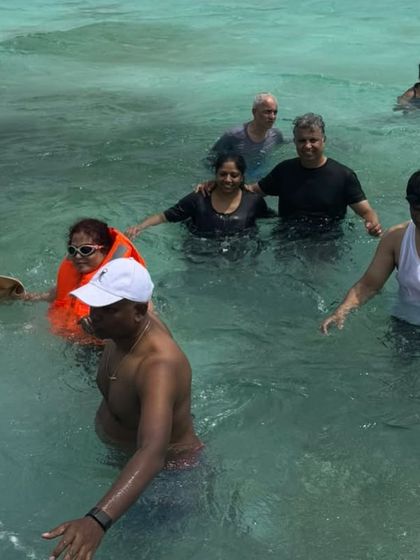 A group of friends enjoying the shallow waters in the Maldives. Our trips are great for non-divers too.