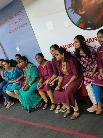 Participants waiting for their turn, sharing a moment of camaraderie during the corporate team-building event.
