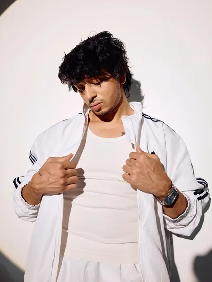 Another look from the all-white tracksuit series. These photos are all about a fresh, modern, and confident image.