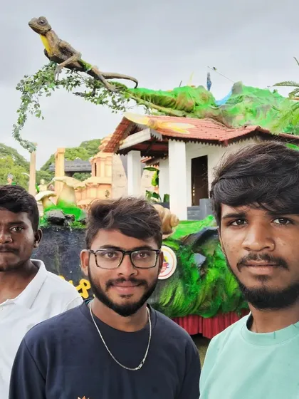 Here I am with my team in front of a float depicting a classic village home. We included small details like the tiled roof and a lizard on a branch to make the scene feel authentic and familiar.