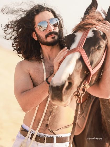 An extensive editorial series of a male model with a horse on the beach. I used a mix of color and black and white, along with varied poses, to create a powerful narrative of untamed strength and freedom.