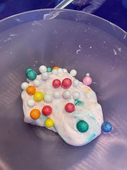 The wonderful, squishy texture of homemade slime, complete with colorful foam beads. Slime making is a fantastic sensory activity for kids of all ages.