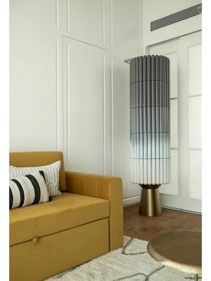 The fluted ombre-finish bar unit is a standout piece in this den. It's a functional sculpture that elevates the room, making it the perfect spot to unwind.