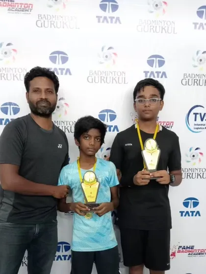 A coach with two young winners at the Fame Badminton Academy tournament in Chennai. We manage intra-academy events across our centers nationwide.