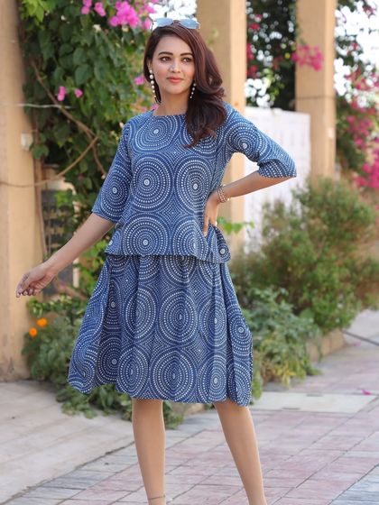 A modern co-ord set with a concentric circle print in indigo. The elbow-length sleeves on the top provide comfortable coverage.