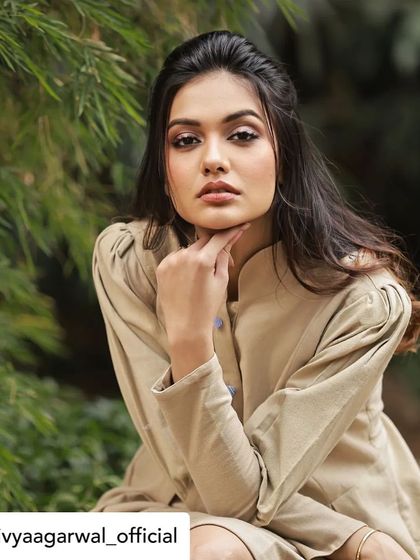 Divya Agarwal looking poised and elegant in our custom-designed tunic dress. The high collar and structured shoulders create a sophisticated silhouette.