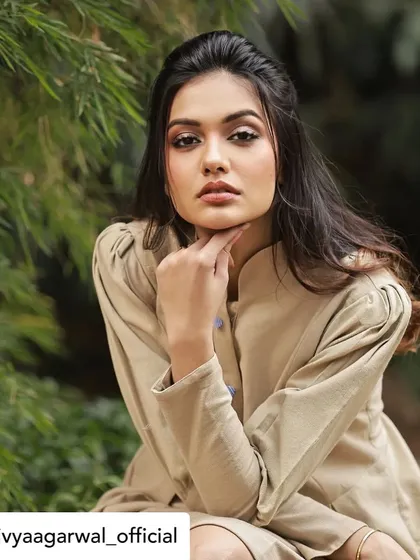 Divya Agarwal looking poised and elegant in our custom-designed tunic dress. The high collar and structured shoulders create a sophisticated silhouette.