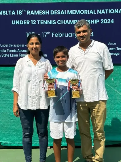Aarav with his parents at the 18th Ramesh Desai Memorial Nationals. Their support is the foundation upon which his success is built.