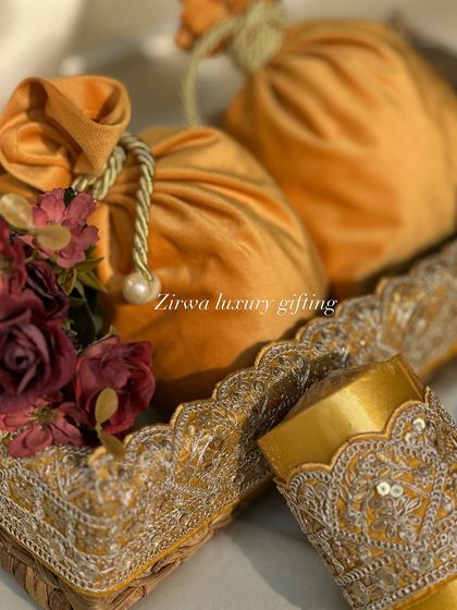 For a yellow-themed Lohri party, I curated these beautiful favours. The mustard yellow velvet potlis are paired with embroidered bangles, creating a rich and traditional look.