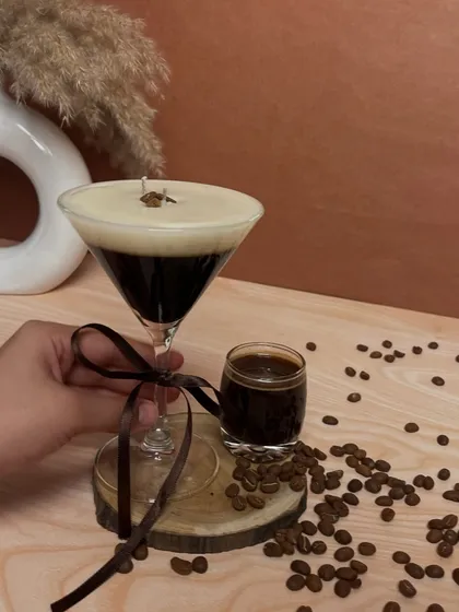 A closer look at the Espresso Martini candle before it's lit. The coffee bean detail on top adds to its realistic charm.