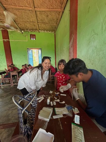 Posing for a photo during a health camp. These moments of connection make the hard work worthwhile.