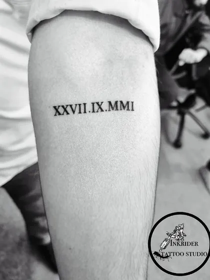 A significant date inked in Roman numerals. This is a classic and stylish way to commemorate a special day forever.