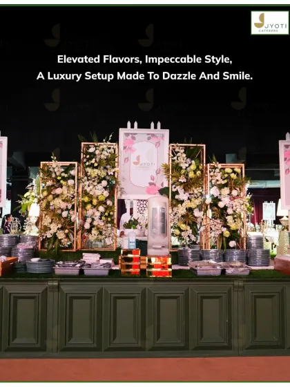 This luxury buffet setup combines modern elegance with classic floral beauty. The gold-trimmed frames and abundant white and pink flowers create a sophisticated focal point for the event.