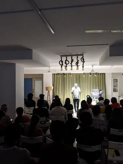 A wide shot of our studio during a storytelling event, showing the intimate and focused atmosphere.