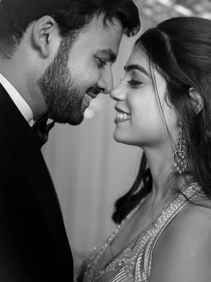 An intimate, black and white portrait that strips away all distractions, focusing solely on the connection and quiet confidence between a couple. This is our artful approach to modern love.