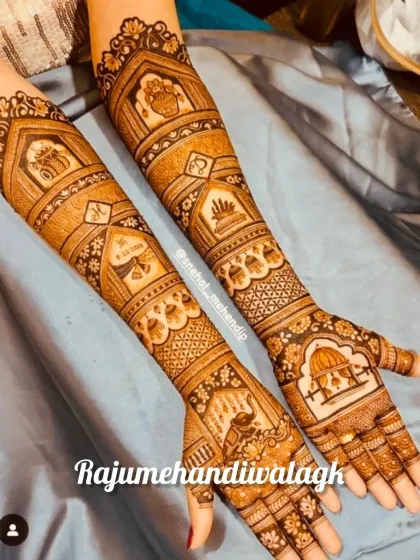 A design filled with auspicious wedding symbols, including the kalash, elephants, and palace jharokhas, creating a very traditional and meaningful mehendi.