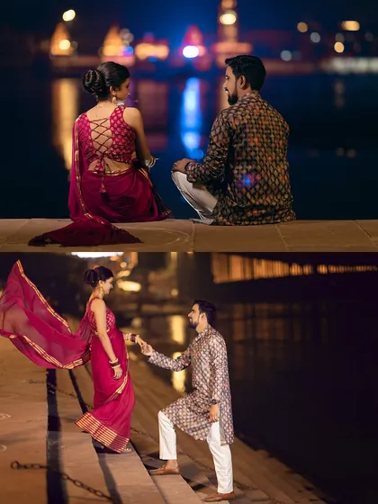 A beautiful moment of romance on the ghat steps at night. The flowing saree and the gentle pose create a classic, romantic image against the backdrop of the river lights.