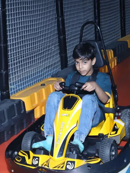 This young racer is all set for an adventure on our go-kart track. The easy-to-steer wheel and secure seating make it a favorite for kids of all ages.