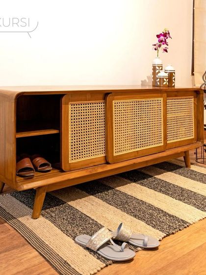 Another view of the 'Penthes' shoe rack, a piece that adds richness and depth to a foyer space.