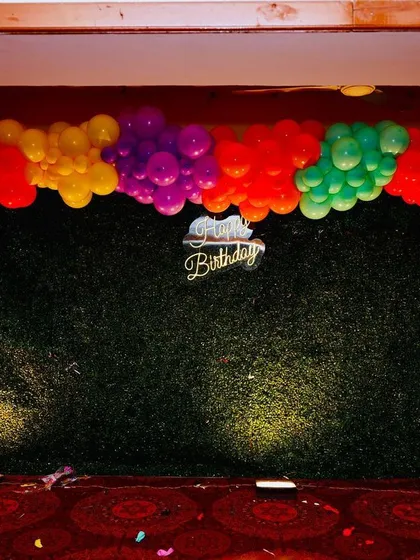 A duplicate image of the versatile green hedge backdrop, ready to be customized for any birthday party theme.