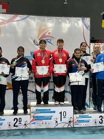**Podium Finish at the World Championship.** Aaditya Yadav on the podium for the Junior Women's Doubles event at the 3rd Junior World Deaf Badminton Championship, securing a silver medal for India.