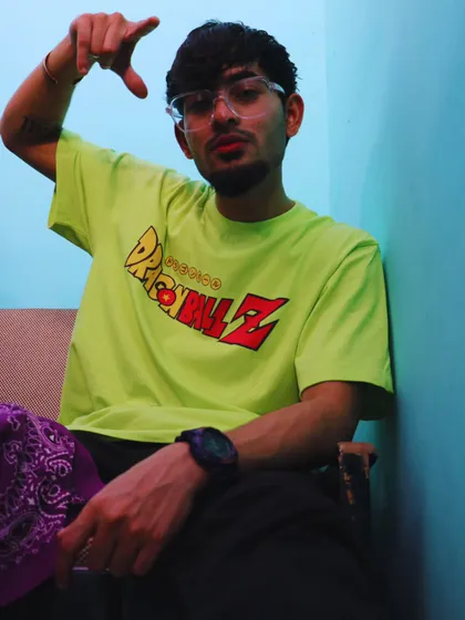 A behind the scenes shot from the 'Real Thug' music video. The Dragon Ball Z shirt and purple bandana show my personal style influences.