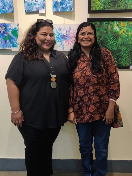With a friend at the gallery, sharing a happy moment.