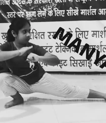 My student Manya in a deep horse stance. This fundamental pose builds lower body strength and stability, the root of all power in Kung-Fu.